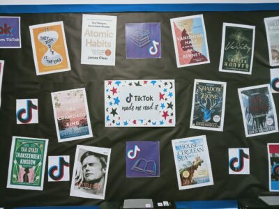 Display board with TikTok book recommendations.